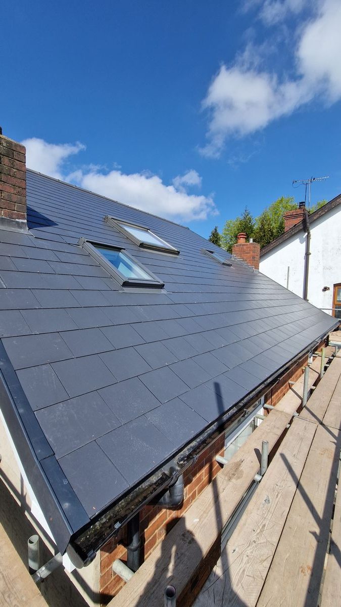 Red clay tile re-roof with flat roof section, Birmingham