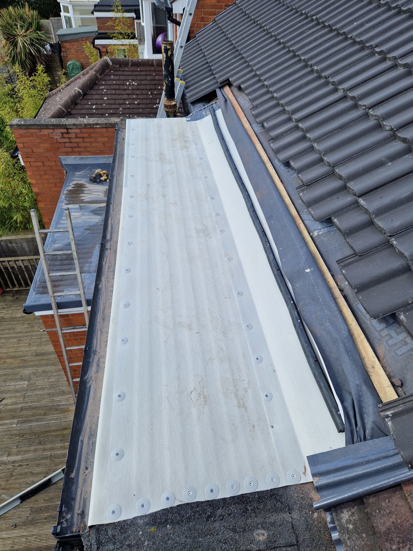Dryseal GRP panels being laid on OSB deck, Birmingham rear extension