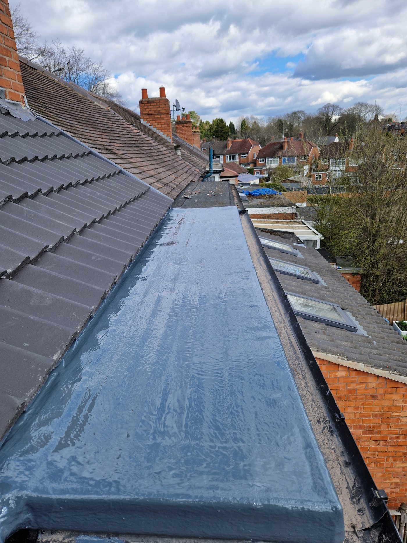 Completed Dryseal GRP flat roof after topcoat application, slate grey finish, Birmingham