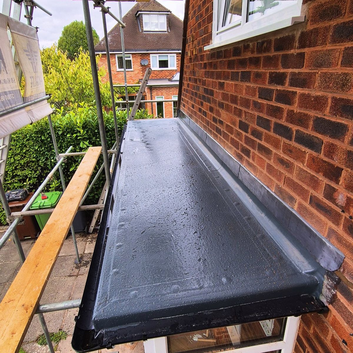 GRP flat roof on bay window extension, viewed from scaffolding, Birmingham